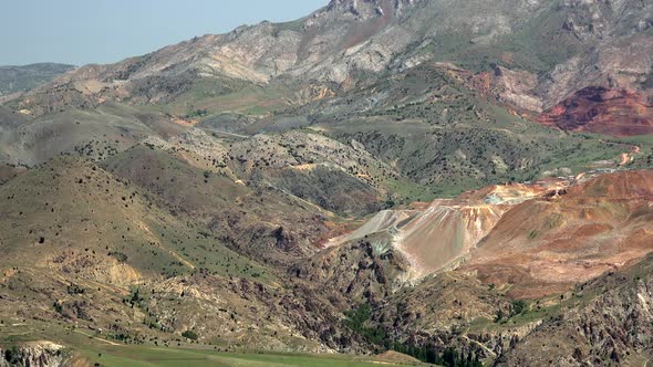 Colorful Mine Lode on Soil Surface in Mountains alt