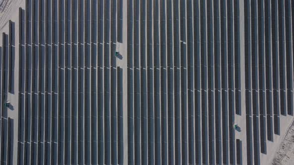Aerial Lookdown Solar Panel Farm Green Energy at Winter Snow Sunny Day Drone Shot of Ecology Power