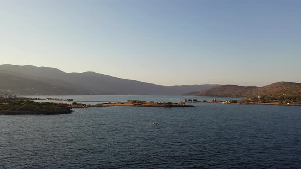 Aerial View of a Motor Boat in a Deep Blue Colored Sea. Kolokitha Island, Crete, Greece