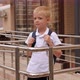 Portrait of a Little Schoolboy Boy with a Backpack Near a Modern School Building - VideoHive Item for Sale