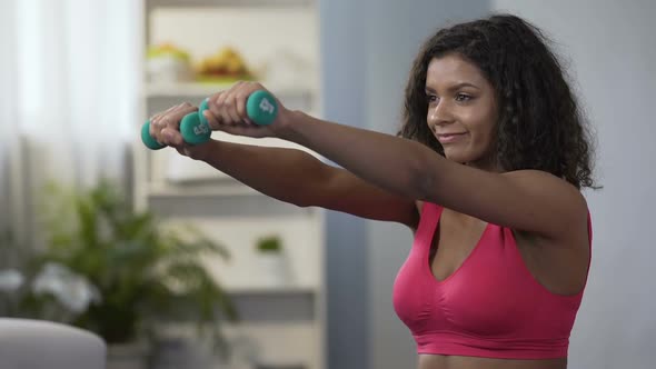 Attractive Woman Lifting Dumbbells, Active Lifestyle, Physical Exercise, Fitness alt