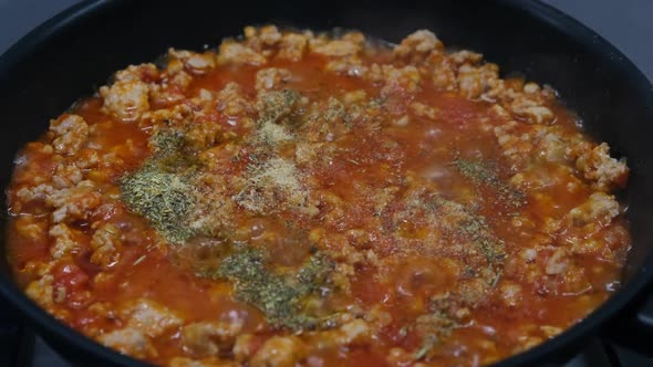 Bolognese Sauce is Cooked in a Skillet Closeup