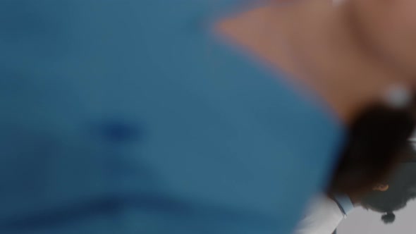 Vertical Video Practitioner Doctors Helping Patient to Stand Up From Bed Holding Intravenous IV alt