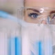 Doctor Carefully Drips Medicine From Pipette Into Sample Glass Tubes for DNA Analysis at Laboratory - VideoHive Item for Sale