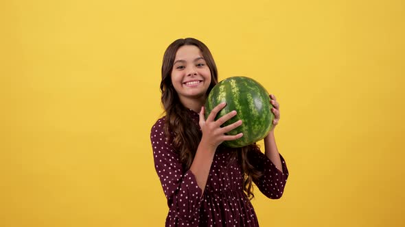 Happy Child Hold Water Melon on Yellow Background Fruit