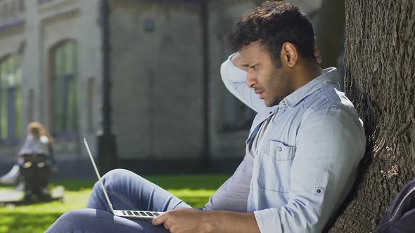 Frustrated Student Receiving Letter About Sending Down and Thinking What to Do alt