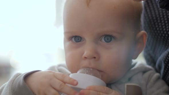 Baby Drinking Milk From Bottle