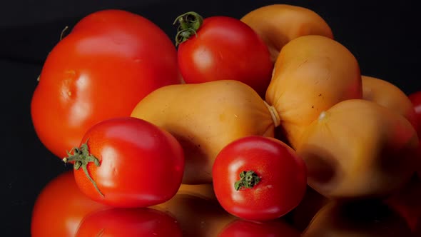 Different Tomatoes Lie Among Sausages Before Preparation alt