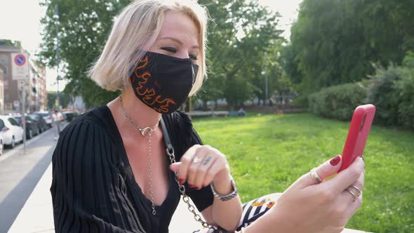 Woman wearing mask having video call