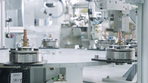 Advanced robotic machine manufacturing parts in an automated assembly line alt