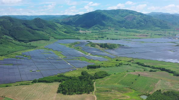 Aerial view of Ecology solar power station panels in the fields green energy. Landscape electrical i