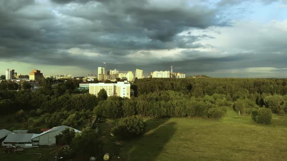 Aerial View Of Summer Forest And City. View From Height Of  Buildings In A Forest In Russia alt