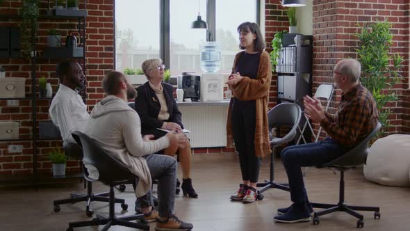 Happy Woman Sharing Therapy Progress and Receiving Applause From People at Aa Meeting alt