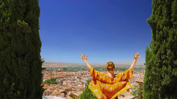 Back View of Young Woman Finding Success in Beautiful View alt