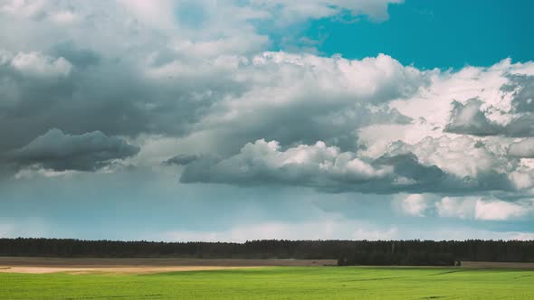 Sky With Clouds On Horizon Above Rural Landscape Meadow Time Lapse alt