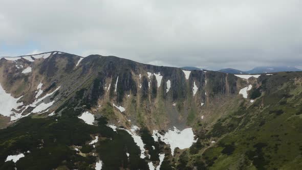 Aerial View of the Colorful Spring Sunset Over the Mountain Ranges alt
