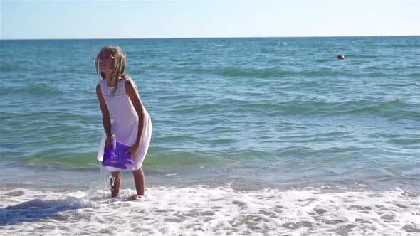 Cute Little Girl at Beach During Caribbean Vacation