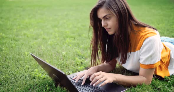 Woman with Laptop Working Outdoors