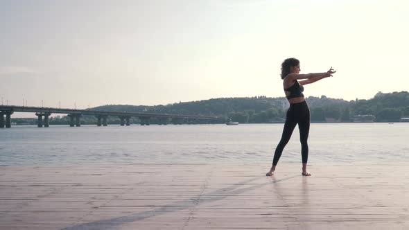 Sports Girl Doing Fitness on the Pier