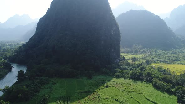 Landscape around the city of Vang Vieng in Laos seen from the sky alt