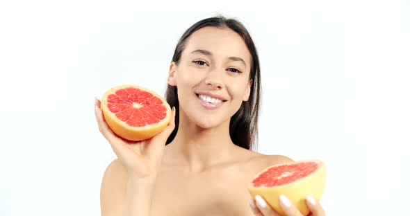 Woman with Grapefruit Isolated on White