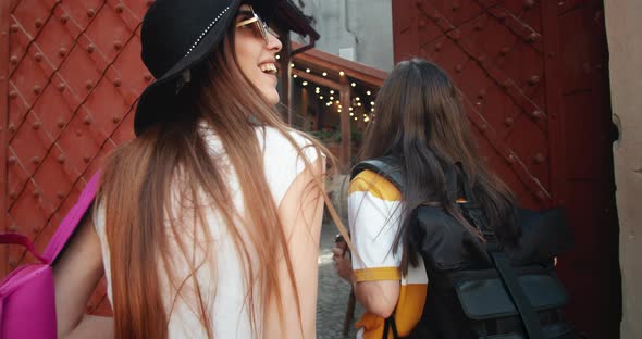 Female Tourists Walking on Old City Street