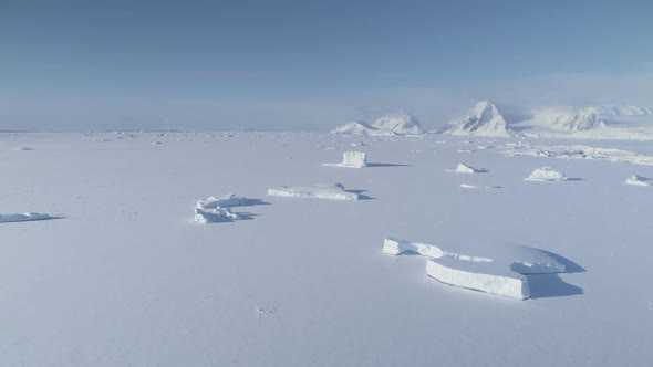 Antarctica Iceberg Locked in Ice Aerial View alt