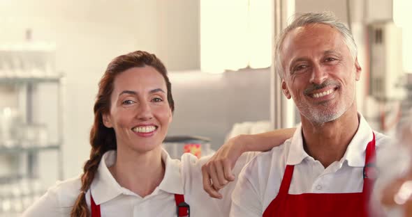 Happy server team looking at camera alt