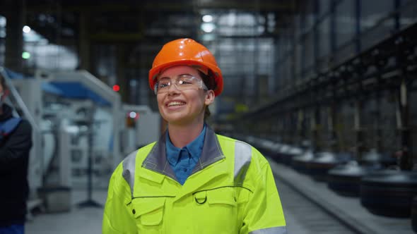 Joyful Engineer Laughing Safety Uniform at Modern Warehouse Say Hello Closeup alt
