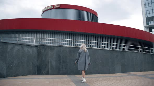 Girl Walking Around City in Urban Wear at Modern Buildings or Street alt