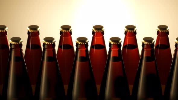 Two rows of brown beer bottles in a closeup view. Endless, seamless loop. 4K HD