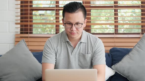 Young man working from home alt