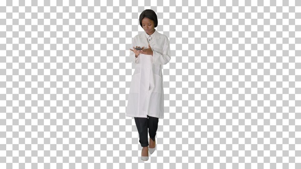 African American female doctor using phone, Alpha Channel alt