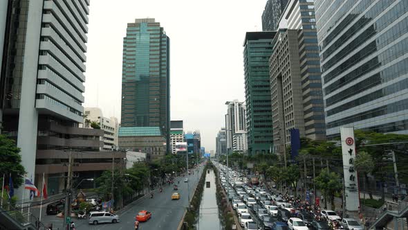 Traffic jam on the avenue in downtown at rush hour, daytime cityscape alt
