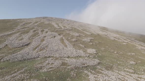 Scenic aerial view of moving white clouds at Abuli Mountain. Georgia alt