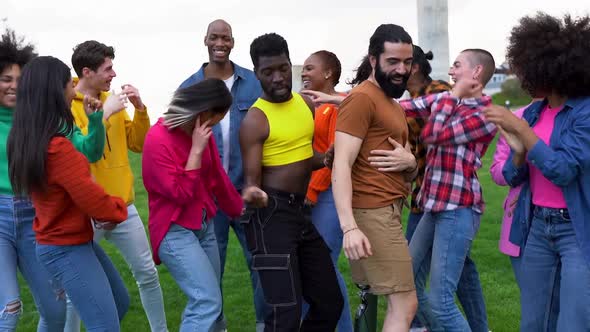 Happy multiracial people dancing outdoor