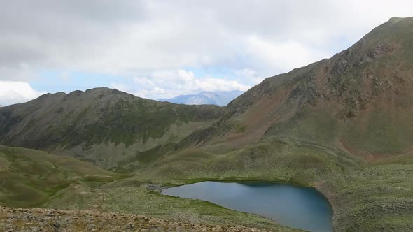 Time-lapse scene in mountains with lake in national park Dombay, Caucasus, Russia