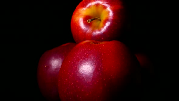 Ripe Red Apples on a Black Background