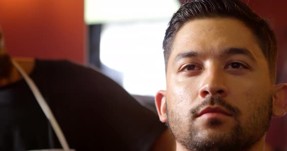 Barber combing customer hair  alt