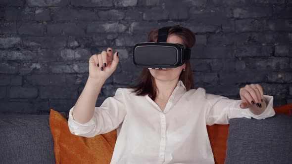 Adult Woman Sitting in 3d Glasses and Using Virtual Interface