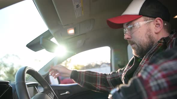 Caucasian Construction Contractor Worker Inside His Pickup Truck alt