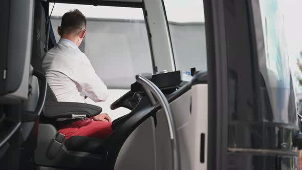 Bus Coach Driver Preparing For Long International Haul alt