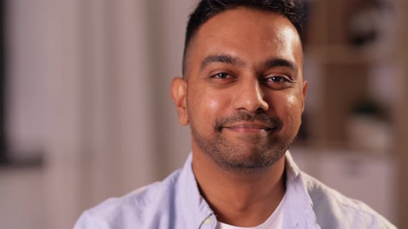 Portrait of Smiling Indian Man with Beer at Home alt