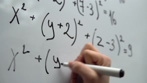 Student Doing Mathematic Exercises Writing Math Equation on Whiteboard