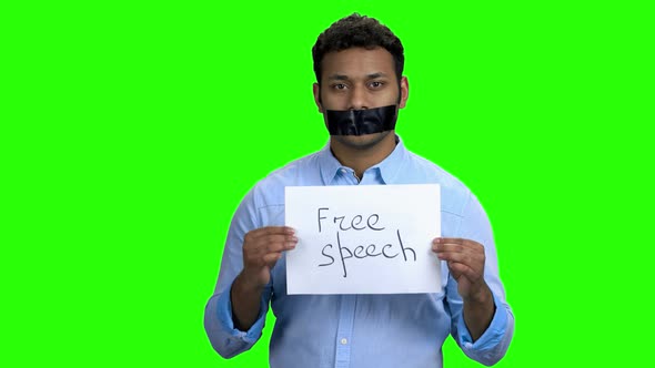 Darkskinned Man Silenced with Black Tape Over Mouth alt