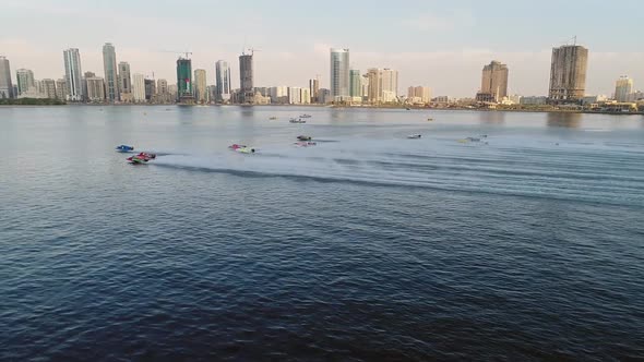 Aerial view of speedboats starting a race in Khalid lake in Sharjah, U.A.E. alt