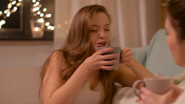 Woman Drinking Tea and Talking To Friend at Home alt