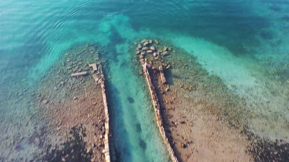 Aerial View of a Motor Boat in a Deep Blue Colored Sea. Kolokitha Island, Crete, Greece