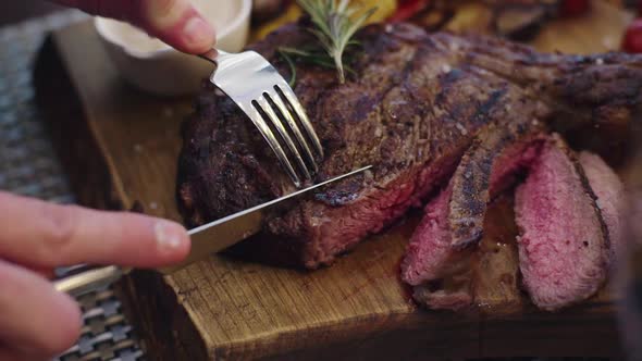 A Very Juicy Beef Steak a Man Cut of the Steak He alt