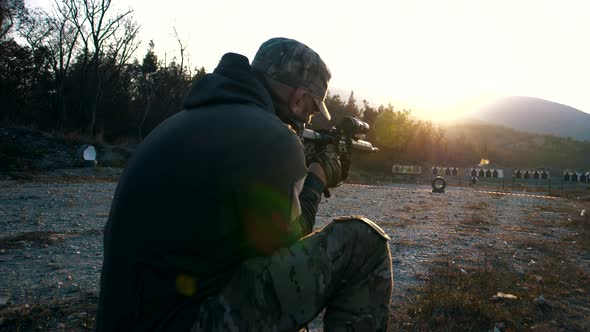 Specialist from the special forces unit fires at a military training ground from a rifle alt